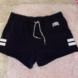Pink athletic shorts size Blackand white lettering sizeL/G